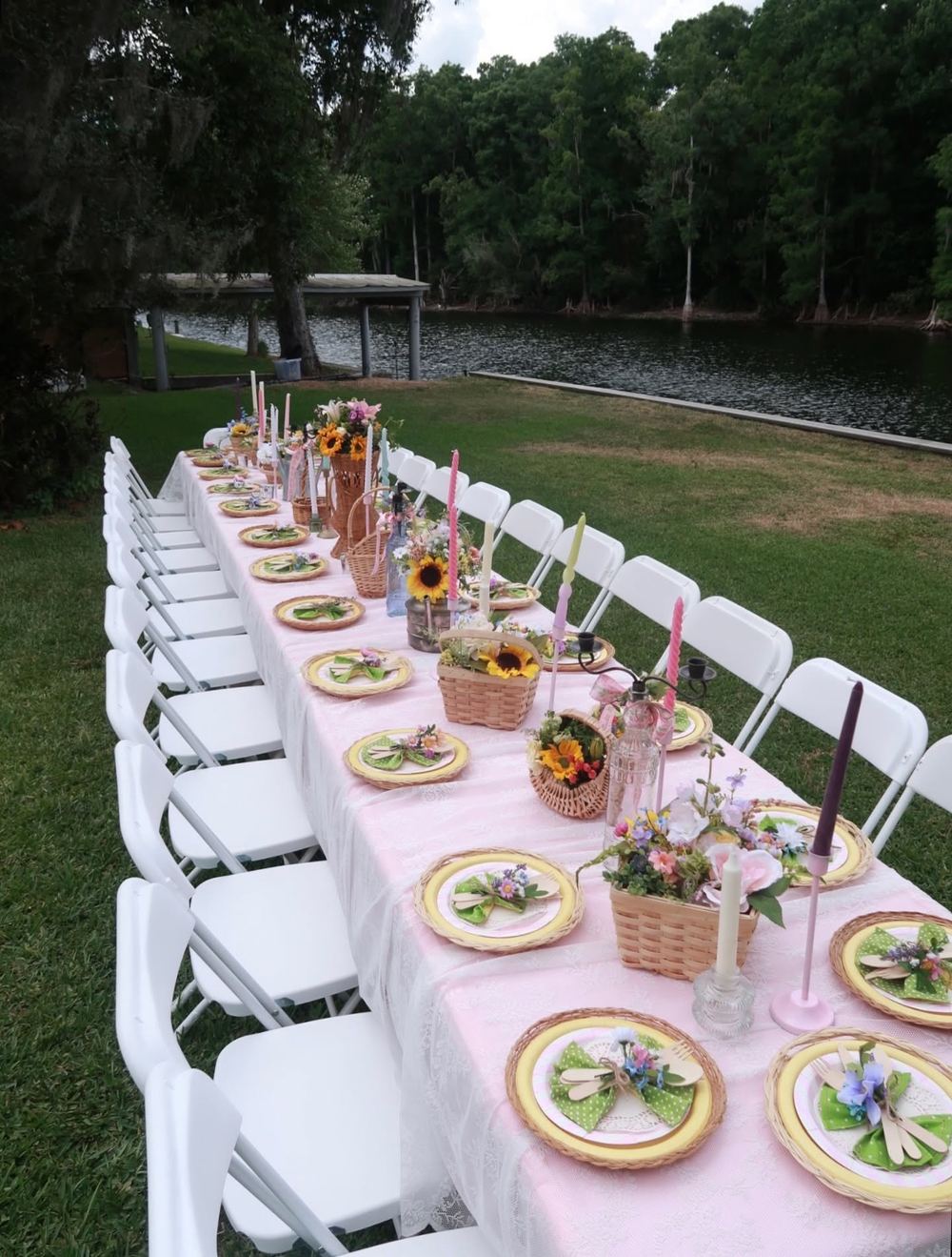 Side view of a client event seating over twenty guests on our white folding chairs
